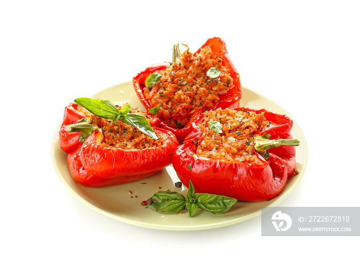 Plate with tasty stuffed pepper on white background