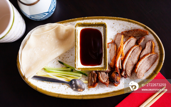 Traditional dish of Chinese cuisine is delicious Peking duck served with hoisin sauce