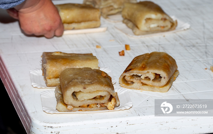 Preparation of CHOCHOCA - tpical food of Chiloe island, Chile. Chiilotan potato bread prepared on wooden stick