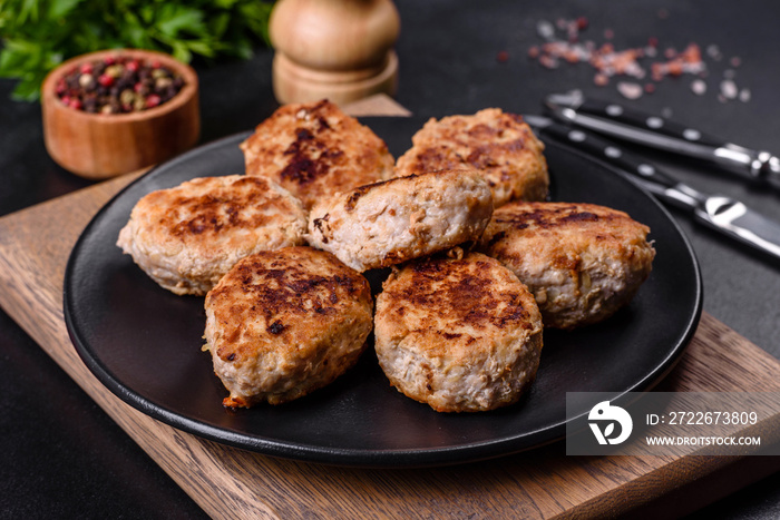 Delicious fresh fried minced meat patties on a dark concrete background