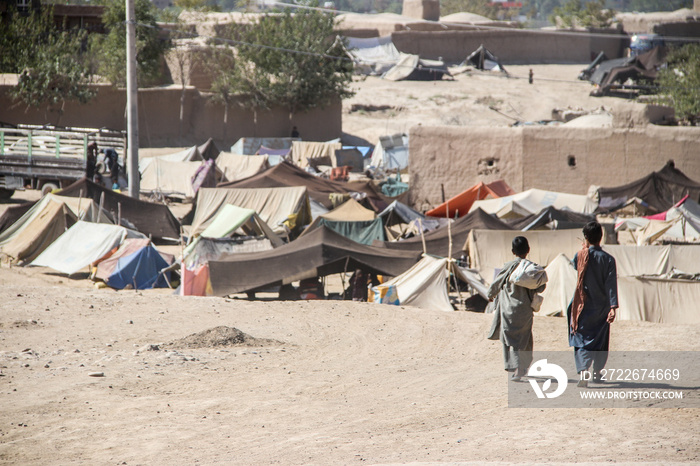 Daily refugee village life in Badghis, Afghanistan in the desert.