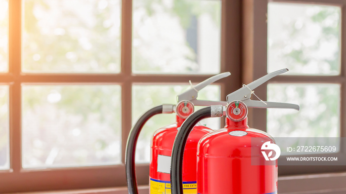 The red fire extinguisher is ready for use in case of an indoor fire emergency.