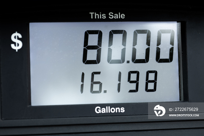 Screen at a gas pump at an American gas station showing the number of gallons and the price of the sale fuel petrol oil