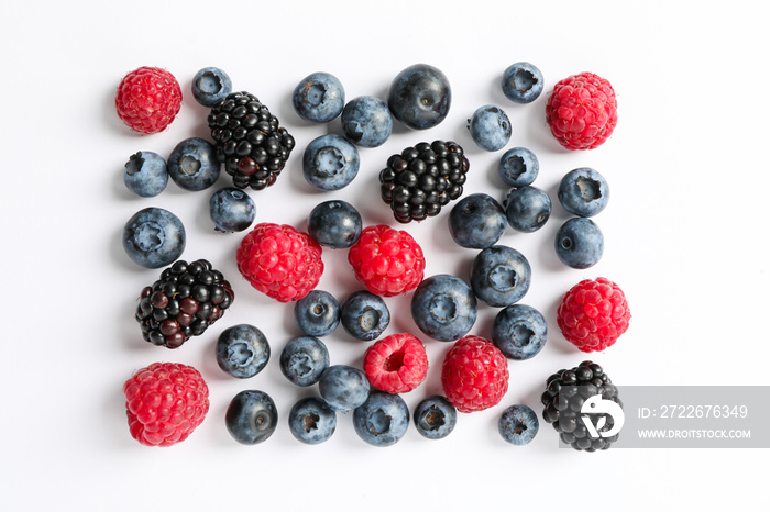 Flat lay composition with berries on white background, space for text