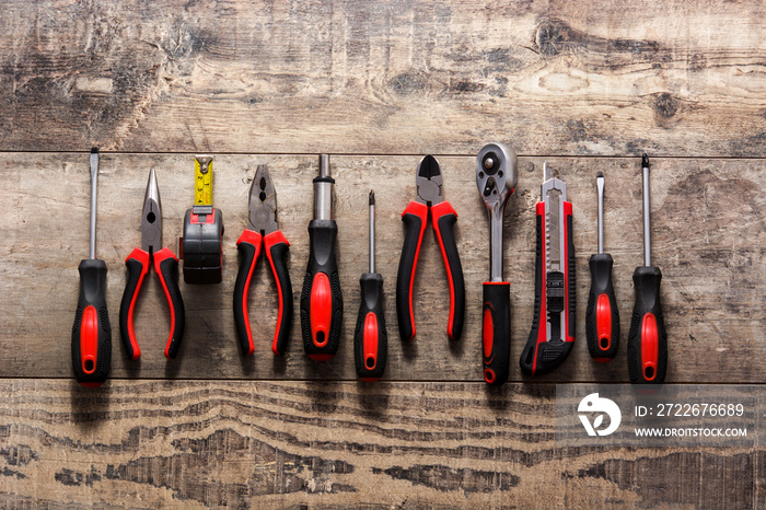 Building tools repair set on wooden table.