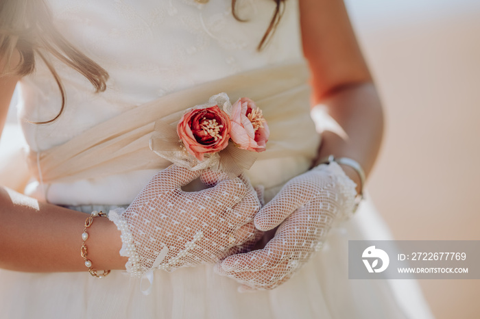 A girl dressed for a first communion