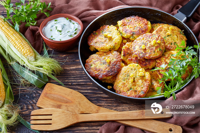 fried corn fritters in a skillet