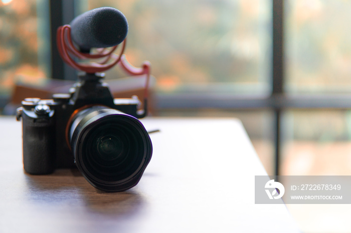 camera with microphone focus at lens no wood table