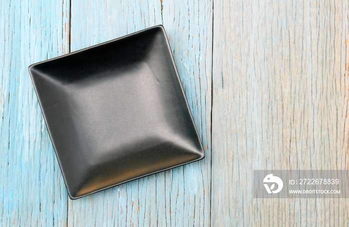 plate on wood table background