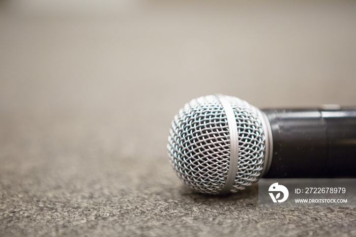 Selective focus of Microphone on stage floor background