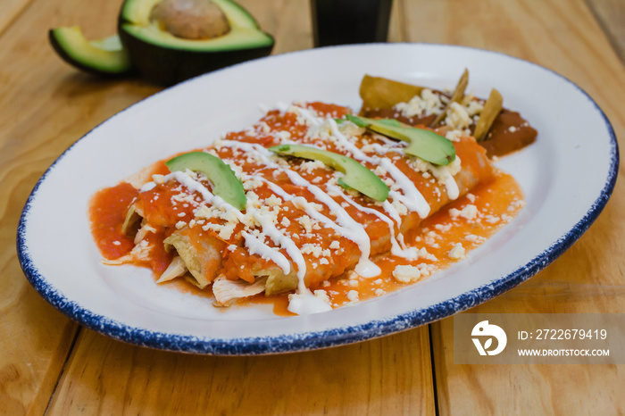 red enchiladas mexican food with tomato sauce and cheese in mexico