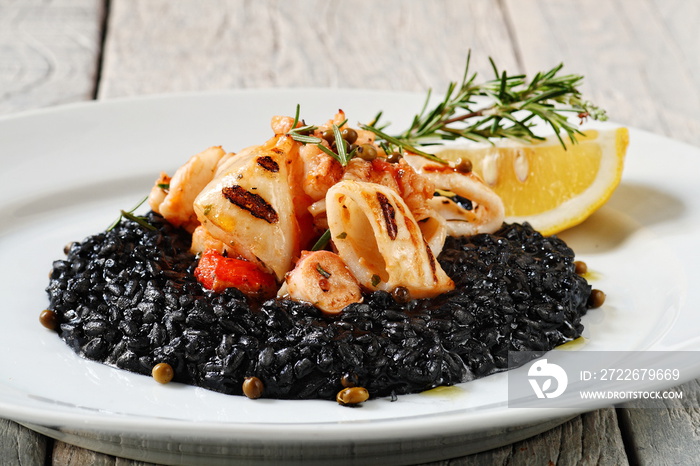 squid and fried scallops with squid ink risotto