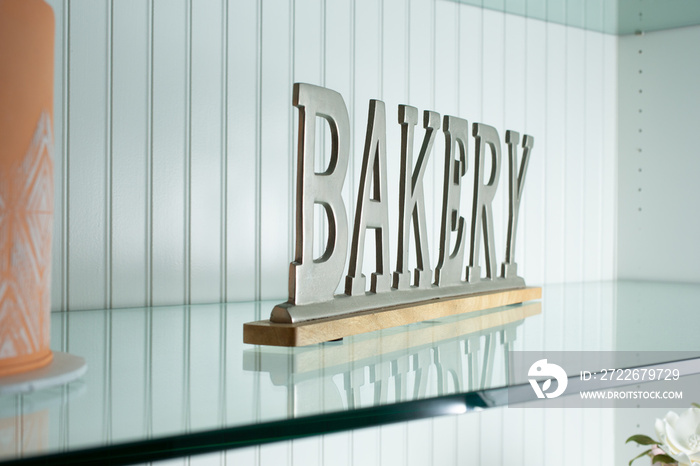 A view of a bakery shelf sign.