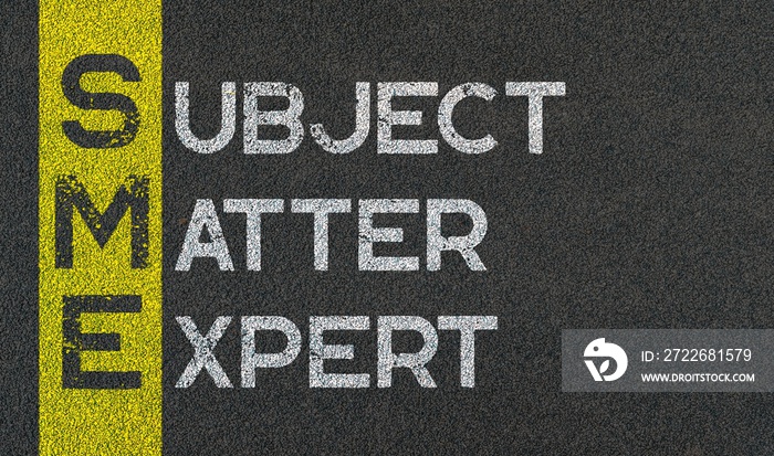 Subject matter expert - SME acronym written on yellow line paint of asphalt