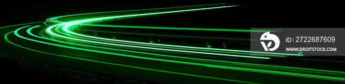 green car lights at night. long exposure