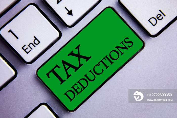 Text sign showing Tax Deductions. Conceptual photo Reduction on taxes Investment Savings Money Returns Text two words green insert button key press grey computer