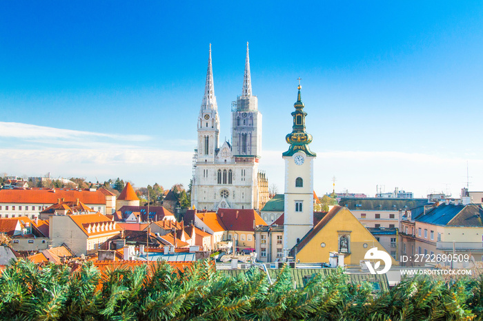 Croatian capital Zagreb, city skyline, catholic cathedral and red roofs in city center, view from Upper town. Christmas advent decoration.