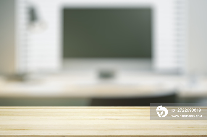 Blank wooden office desk with light workplace with laptop on background, mock up