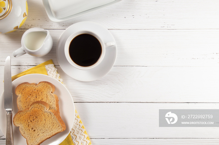 Breakfast of Toast and Hot Coffee on a White Wood Table