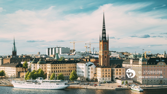 Stockholm, Sweden. Gamla Stan Is Famous Popular Place And Destination Scenic. Riddarholm Church In Sunny Summer Cityscape Skyline. Scenic View Of Embankment In Old Town. UNESCO World Heritage Site.