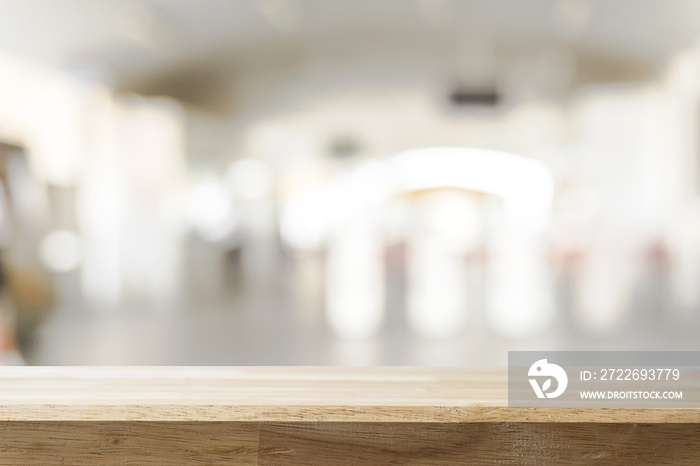 Empty wooden Brown table and blurred subway station background. Mock up for display or montage of product,Business presentation.