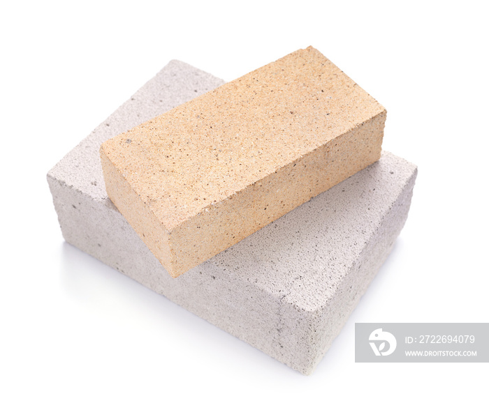 Aerated concrete block and cement brick isolated at white background