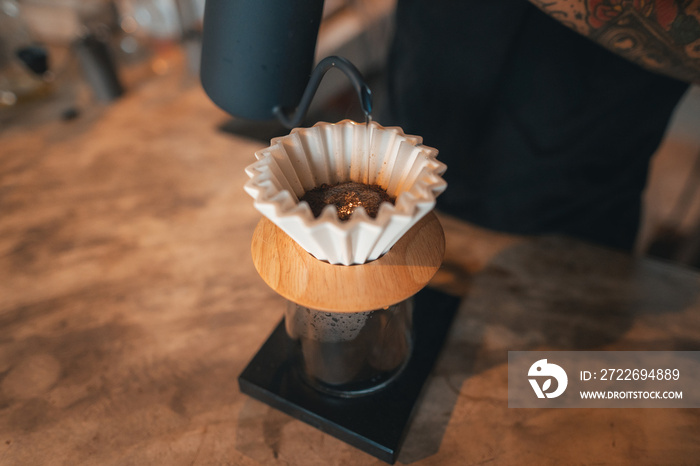 Closeup of hands barista make coffee