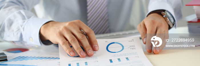 Male hands hold documents with financial