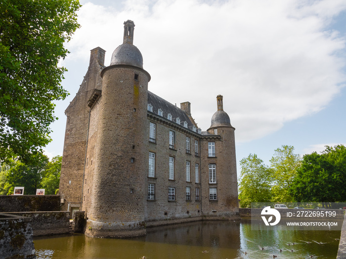 The castle of Flers, now a history museum (Normandy, Orne, France). Beautiful medieval architecture.  Historical monument. Surrounded by a moat. Sunny day.