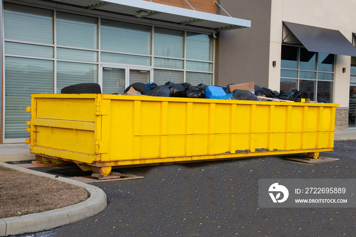 Loaded dumpster near a construction site, home renovation