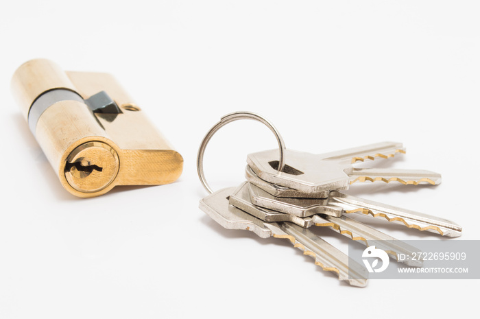 door lock cylinder with bunch of keys on white background