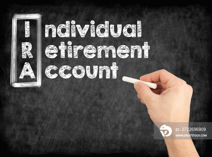 IRA - Individual Retirement Account concept. Hand writing by white chalk on a blackboard.