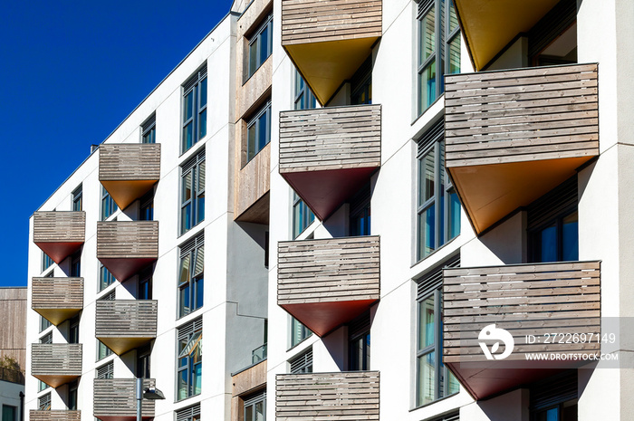 Modern new terraced houses and apartment flats with balconies in England UK, stock photo image