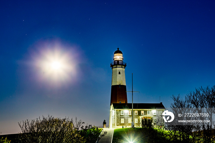 Montauk Point Light lighthouse with moon shine by night, Long Island, New York