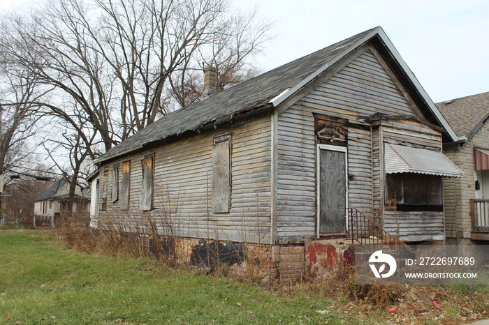 Abandoned grey wood-paneled home in Englewood on Chicago’s South Side