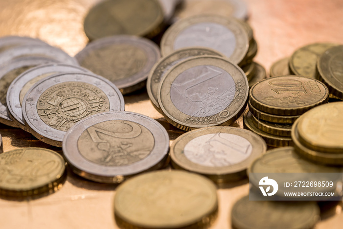 many euro coin isolated on gold close up