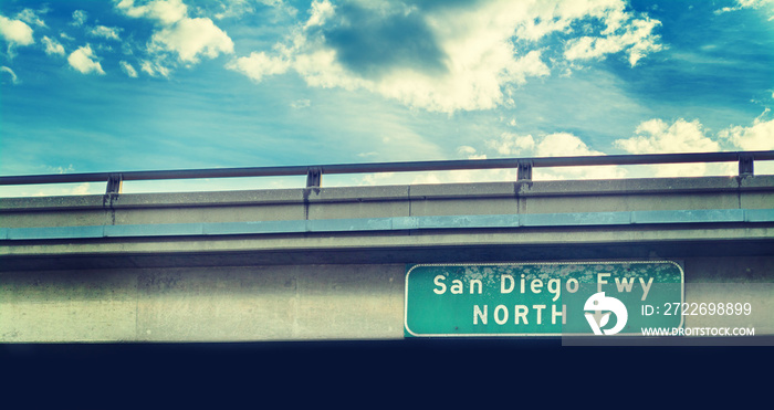 San Diego freeway sign under a cloudy sky