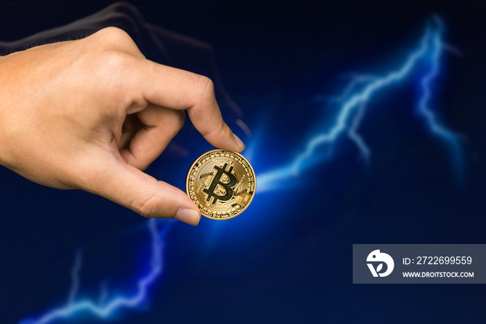 Man holding Bitcoin gold coin in front of lightning network concept background