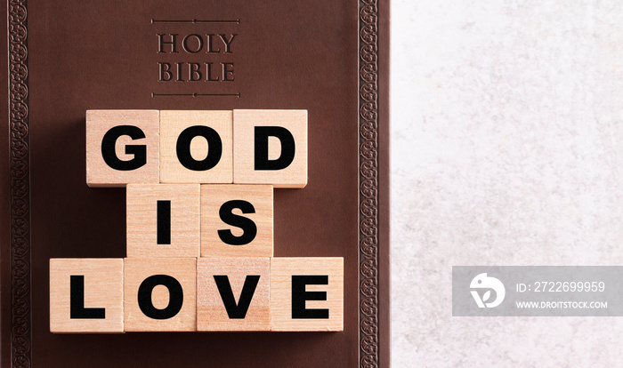 God is Love Spelled in Blocks on a Brown Leather Holy Bible