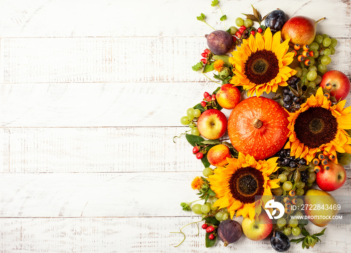 Thanksgiving background with autumn pumpkins, fruits and flowers