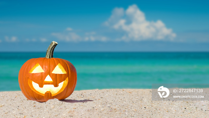 Happy Halloween. Pumpkin Jack-o-lantern on the beach. Jack o lantern for Halloween party. Autumn se