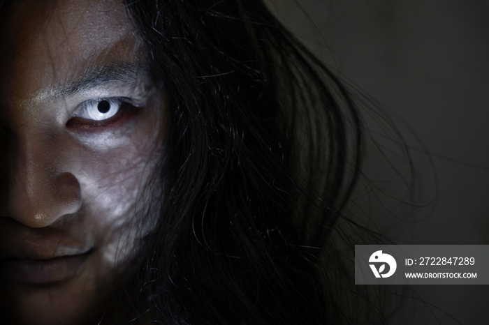 Scary ghost woman. Close up face of Asian woman ghost or zombie horror creepy scary have hair coveri