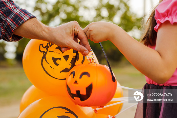 Little kid girl trick or treating on Halloween.