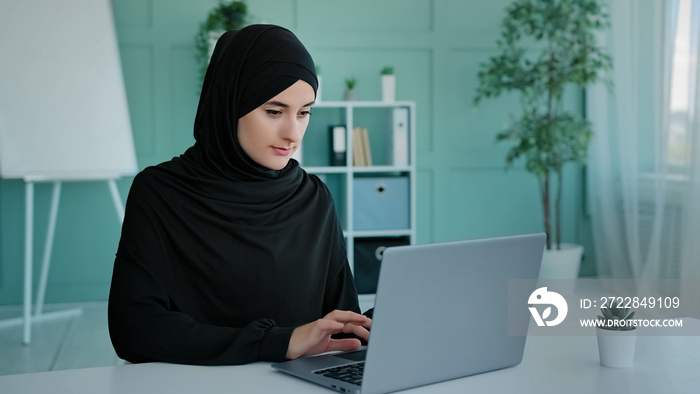 Busy Islam businesswoman in black hijab freelancer Islamic Arabian girl student worker Muslim woman 