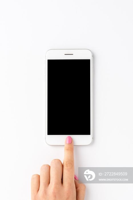 Woman’s hand using smart phone with empty screen isolated on white background. Close up