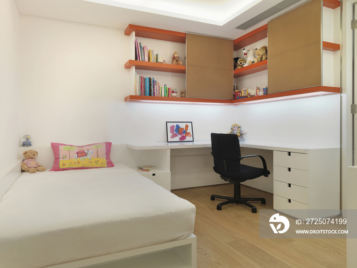 Kids bedroom with study desk below shelves at home; Scottsdale; USA