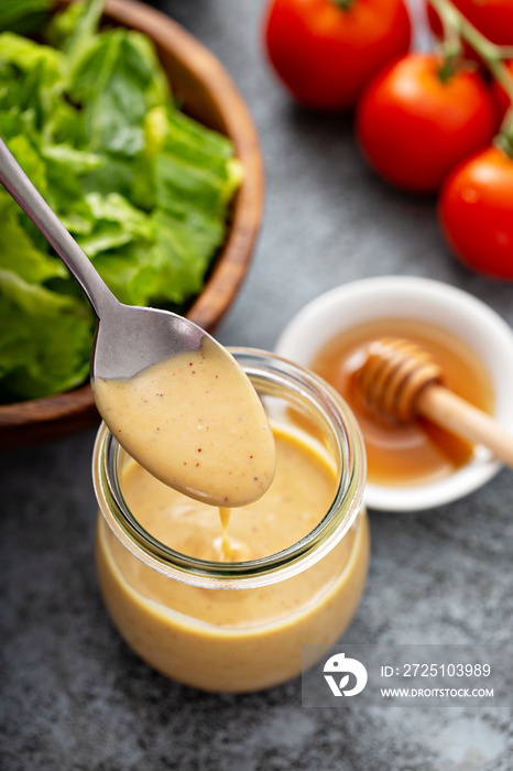 Homemade honey mustard sauce in a glass jar