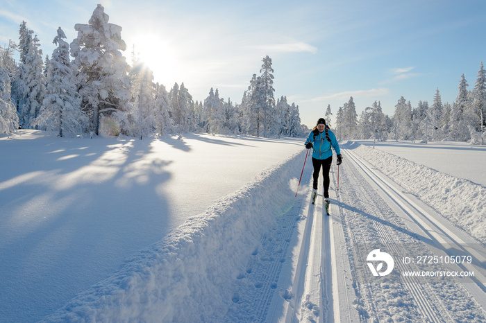 Woman in skislopes, winter in Norway