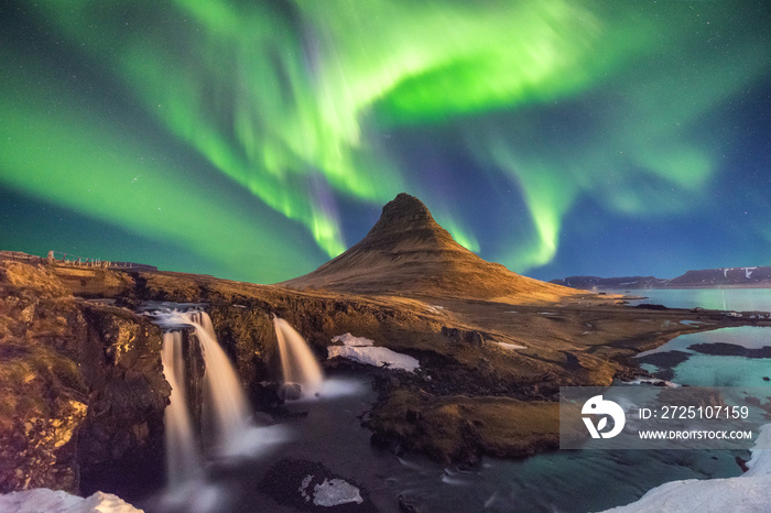 A wonderful night with Kp 5 . Northern lights mountain Kirkjufell in Iceland.
