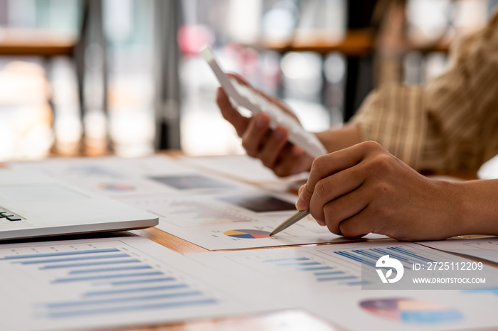 Business man hand hold documents with financial statistic stock photo,discussion and analysis data t